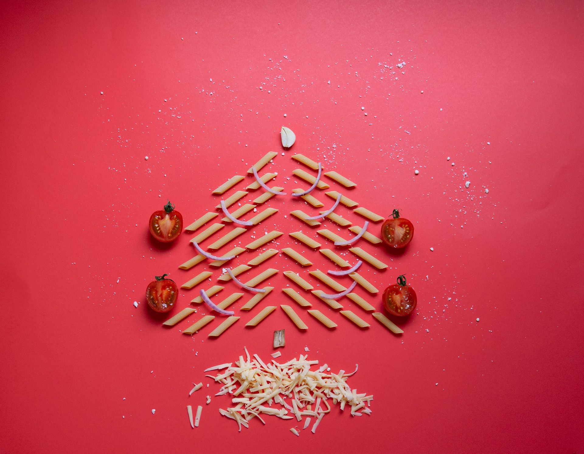 pasta's  Christmas tree decorated tomatoes  and snow of cheese